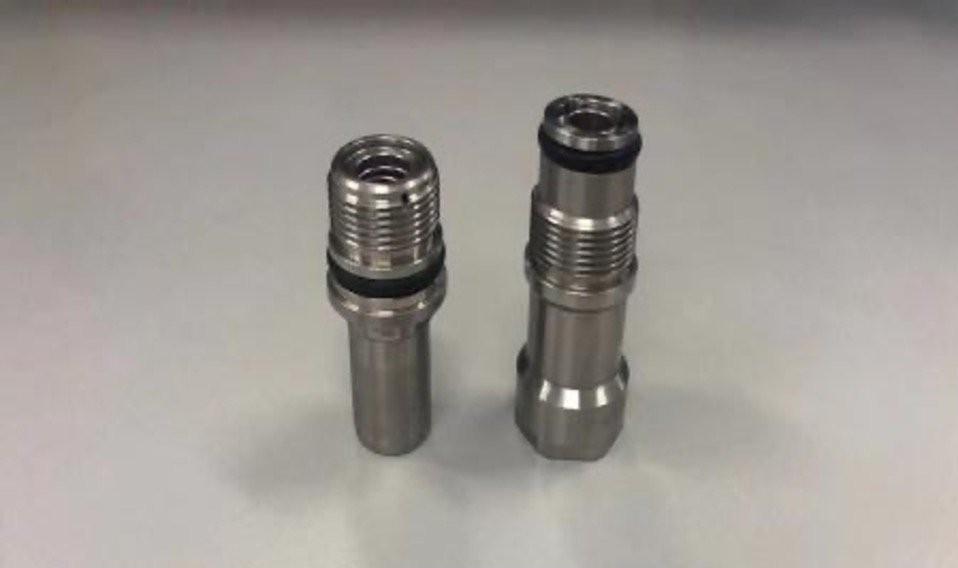 Pair of stainless self-sealing fluid connectors